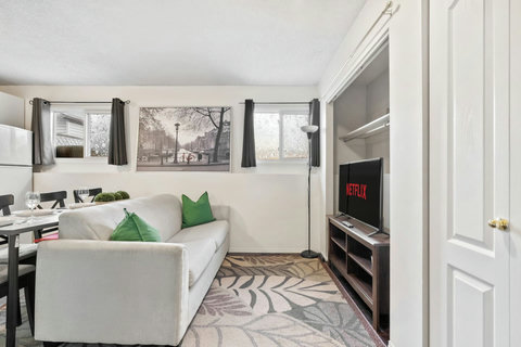 Cozy living space with smart TV and plenty of natural light