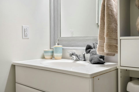 Spa-like bathroom with pristine white vanity and soft lighting