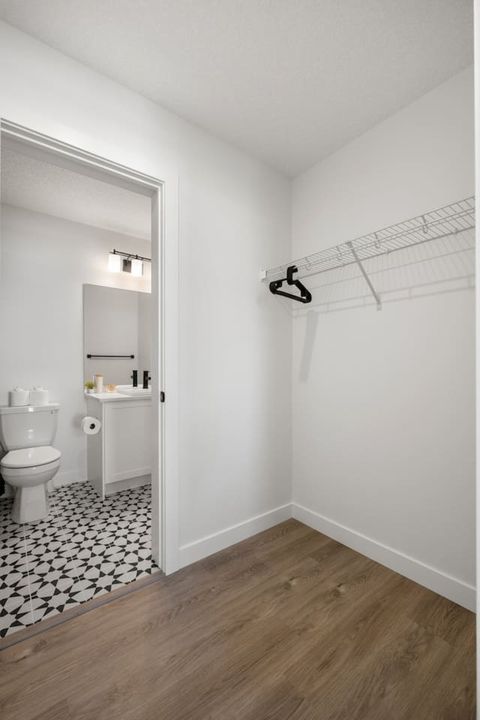 Spacious Master Bedroom Walk-In Closet Offering Ample Storage and Easy Organization
