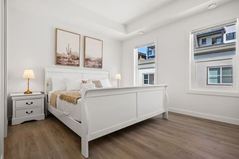Relax In This Cozy King Bedroom, Featuring a Warm Beige, Brown, and White Color Palette for Ultimate Comfort
