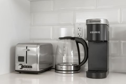 Fully Equipped with Breakfast Essentials, Including a Keurig Machine, Kettle, and Toaster for a Convenient Start to Your Day