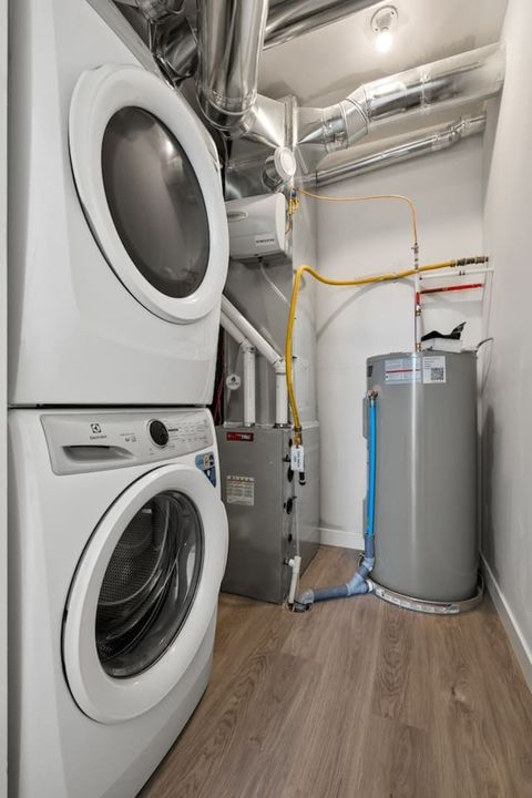 In-Suite Modern Laundry with High-End Washer and Dryer for Your Convenience