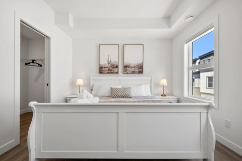 Stylishly Designed King Bedroom Featuring a Luxurious Bed, Elegant Beige Accents, and Ample Space for Relaxation