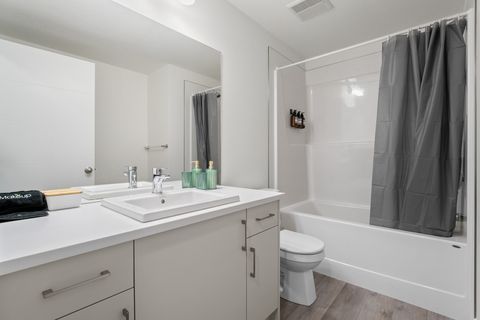 Spa-like bathroom with contemporary fixtures and ample storage space