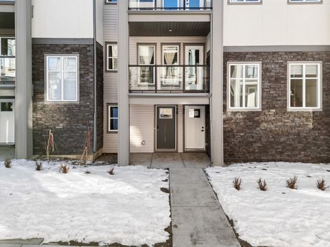 Charming snow-covered courtyard entrance with modern architectural design.