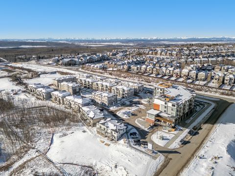 Stunning elevated views of the community nestled against snow-capped mountains