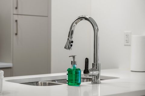 Sleek bathroom featuring contemporary chrome faucet and modern fixtures