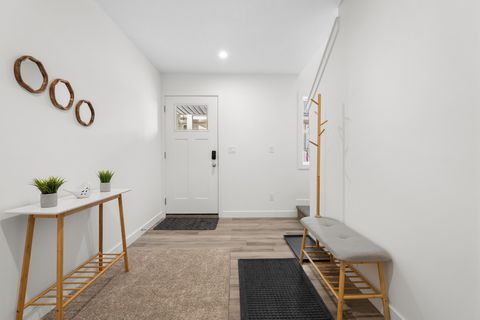 Welcoming entryway with natural wood details and comfortable seating