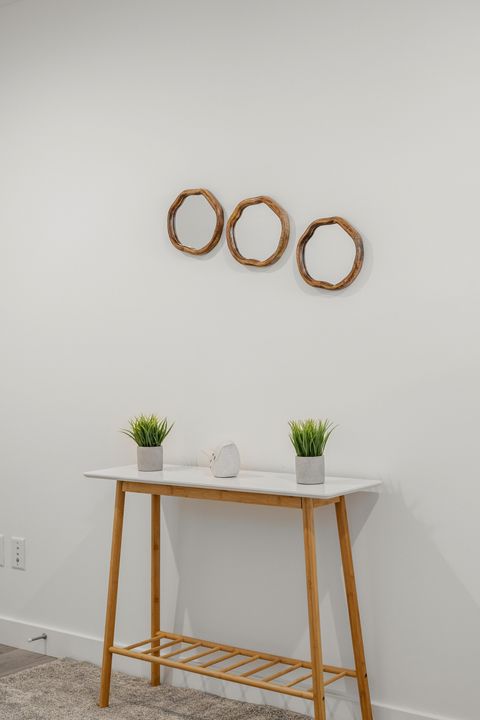 Stylish entryway featuring a sleek console table and curated wall decor