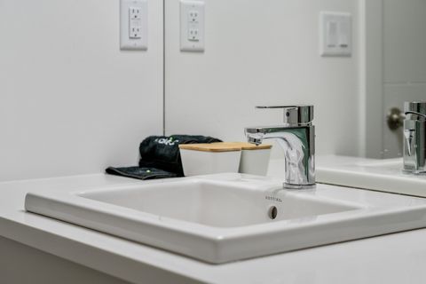 Bright and clean bathroom with modern fixtures and ample counter space