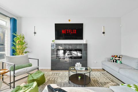 Large Cozy Living Room with Fireplace & 65" Smart TV