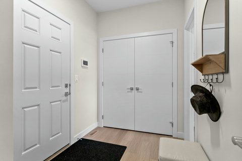Welcome home to a clean, organized entryway with ample storage