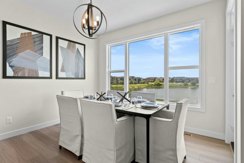 Gather around the dining table with stunning waterfront views all around