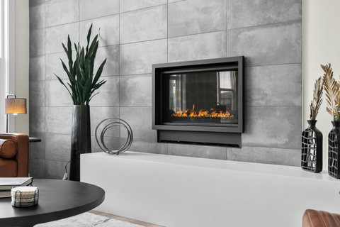 Cozy up by the sleek modern fireplace in this stylish living space