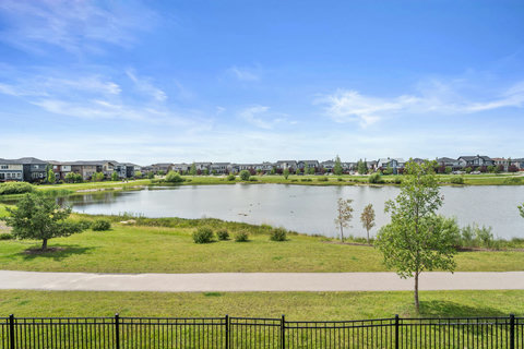 Wake up to serene pond views and lush green parkland every day