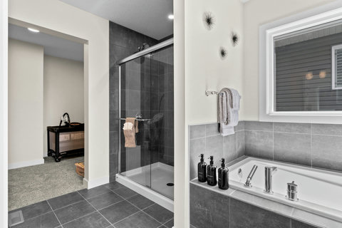 Unwind in your private spa-like retreat with soaking tub and glass shower