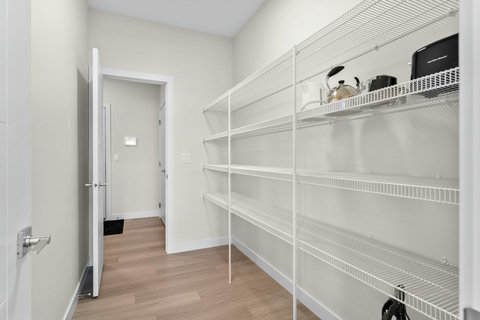 Generous walk-in pantry keeps your kitchen organized and clutter-free