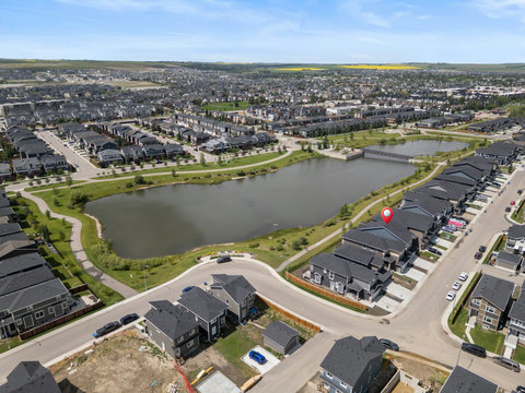 Wake up steps away from a peaceful community pond and green pathways