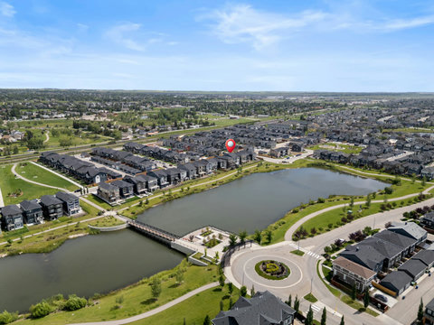 Wake up steps from a serene community lake and scenic walking paths