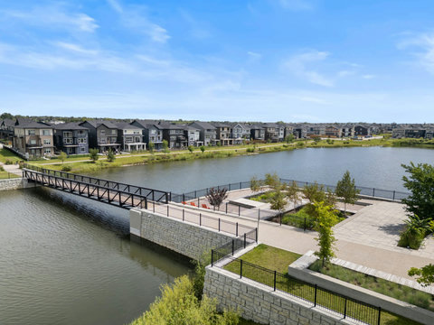 Stroll across the bridge and soak in stunning lakeside living every day