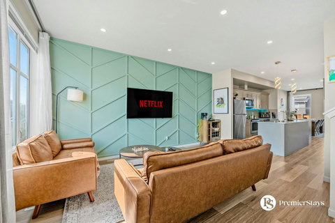 Stylish living area with comfortable leather seating and smart TV