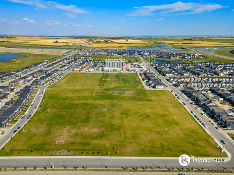 Community park surrounded by modern residential neighborhoods and amenities