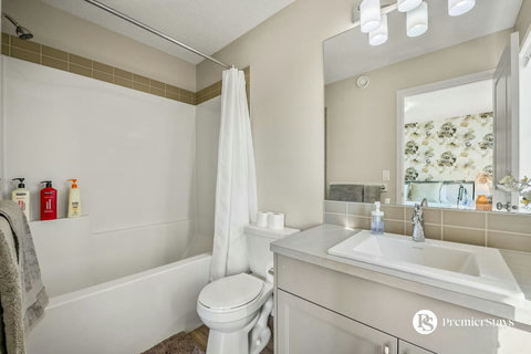 Bright, well-appointed bathroom with spa-like shower and ample counter space