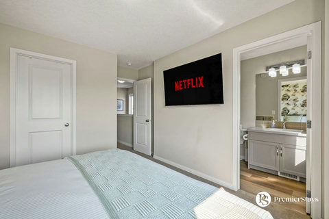 Comfortable master suite with modern entertainment and spa-like ensuite bathroom