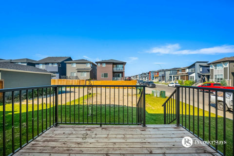 Spacious back deck perfect for morning coffee and neighborhood views