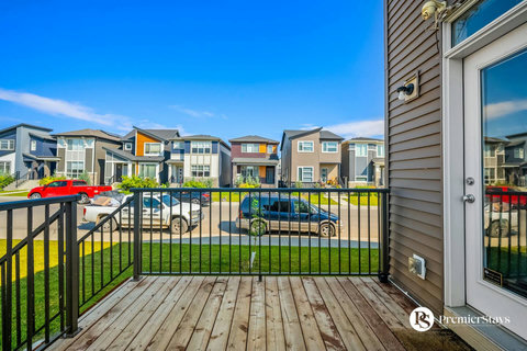 Spacious back deck perfect for morning coffee and neighborhood views