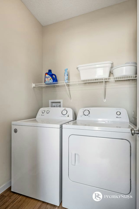 Convenient in-unit laundry room with full-size washer and dryer