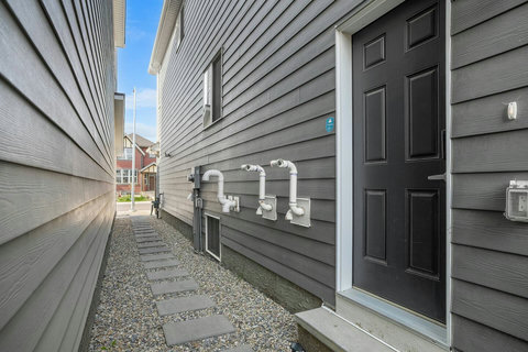 Private side yard access with convenient utility connections.