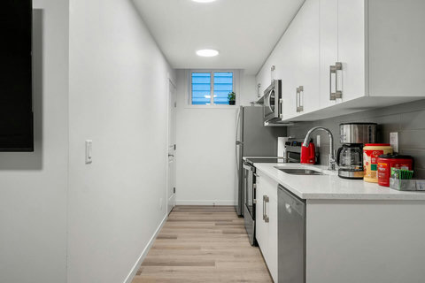 Sleek modern kitchen perfect for preparing home-cooked meals during your stay