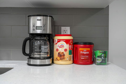 Well-equipped kitchen with coffee maker and morning beverage essentials