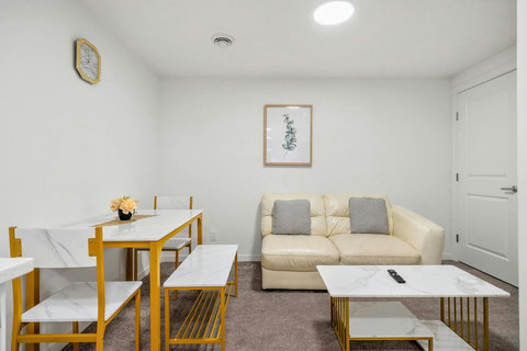 Bright living space with modern seating and dining area