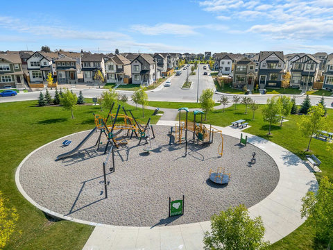 Vibrant community playground with climbing structures and spinning equipment