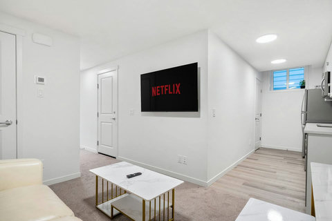 Spacious living room with smart TV perfect for movie nights and relaxation