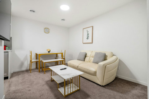 Cozy living room with loveseat, coffee table and Smart TV