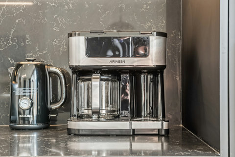 Stylish kitchen featuring premium coffee maker and electric kettle
