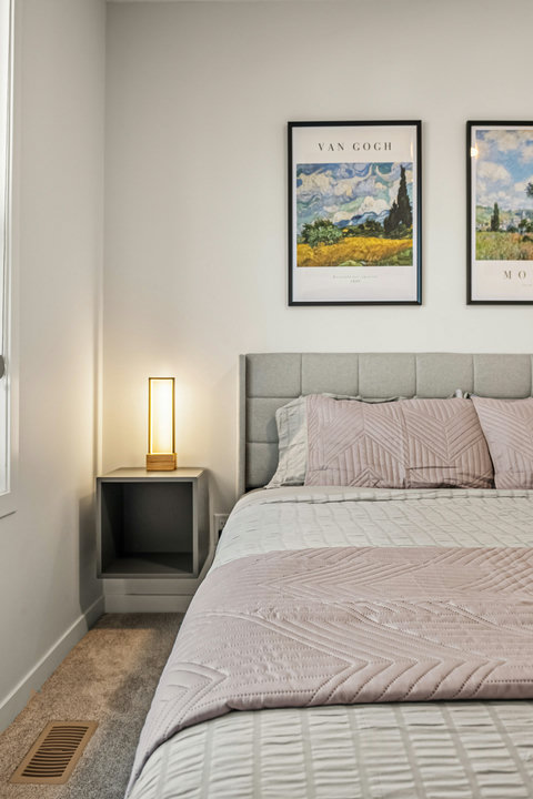 Serene guest bedroom with contemporary furnishings and curated wall art