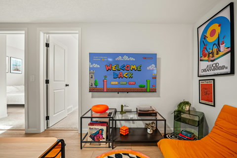 Vibrant living room featuring retro gaming setup and contemporary comfort