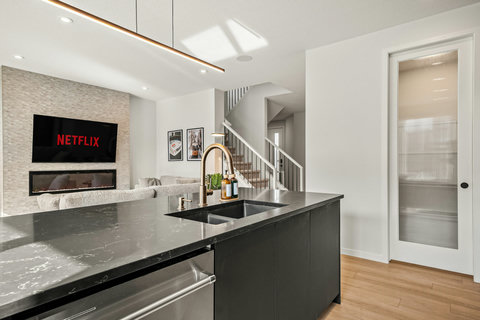 Sleek modern kitchen with stylish island and open floor plan