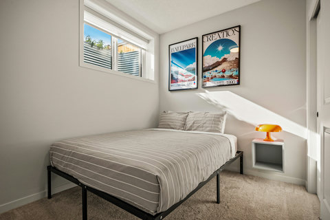 Charming guest bedroom flooded with natural light and vintage inspiration