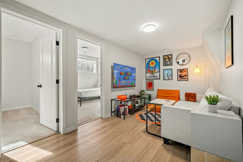 Vibrant living space with curated gaming art and comfortable seating