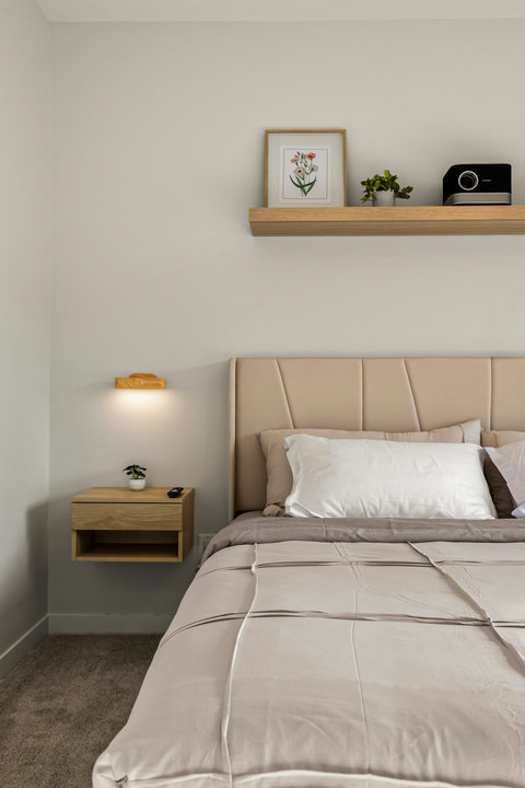 Serene guest bedroom with soft neutral tones and contemporary styling