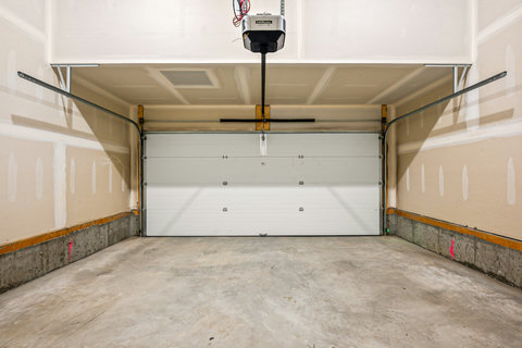 Convenient two-car garage with automatic opener and ample storage space