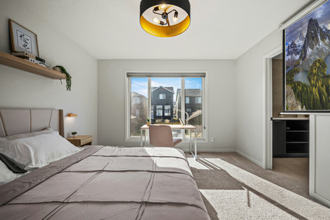 Serene bedroom with private balcony and neighborhood views