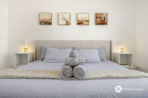 Peaceful primary bedroom with soft linens and thoughtful decor touches