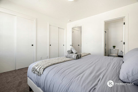 Bright guest bedroom with direct bathroom access and ample storage