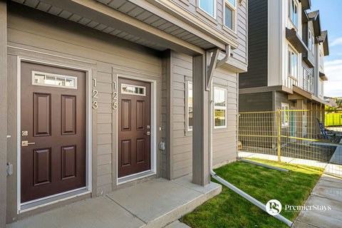 Welcome to your modern townhouse with dual entry doors and inviting frontage
